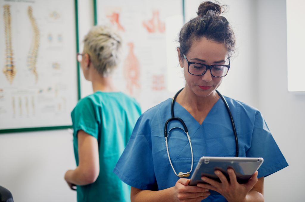 A medical assistant reviews records.